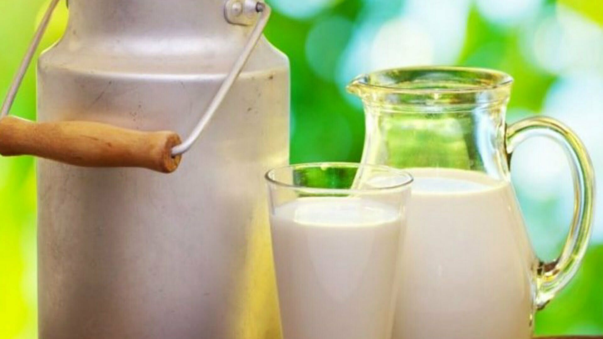 A jug and glass full of milk