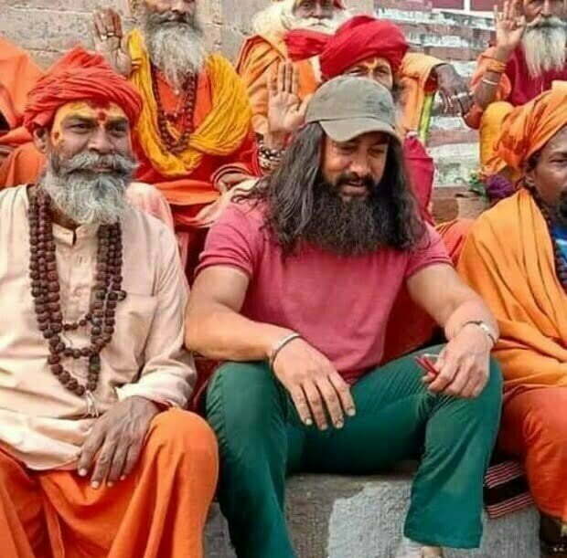 Amir khan sitting with sadhus with long hair