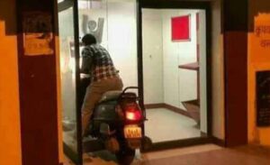 A man entered the ATM on a scooter to withdraw money